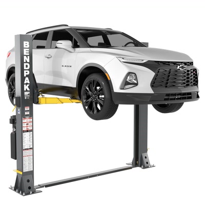 BendPak 9APF low ceiling floorplate 2 post hoist with an SUV raised on the arms