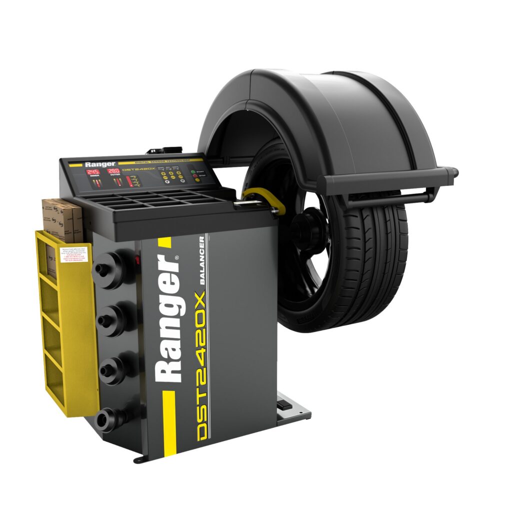 Ranger DST2420 wheel balancer with a wheel mounted and the hood lowered, Genesis Equipment Australia